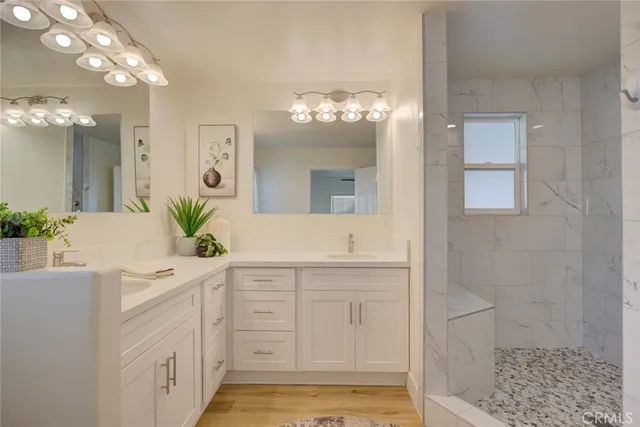 a bathroom with a sink a vanity and a mirror