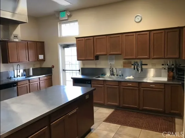 a kitchen with a sink cabinets and window