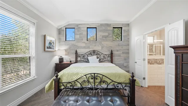 a bedroom with a bed and a dresser