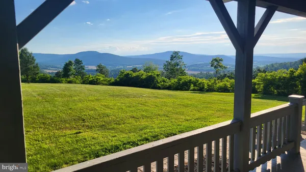 a view of a garden from a balcony