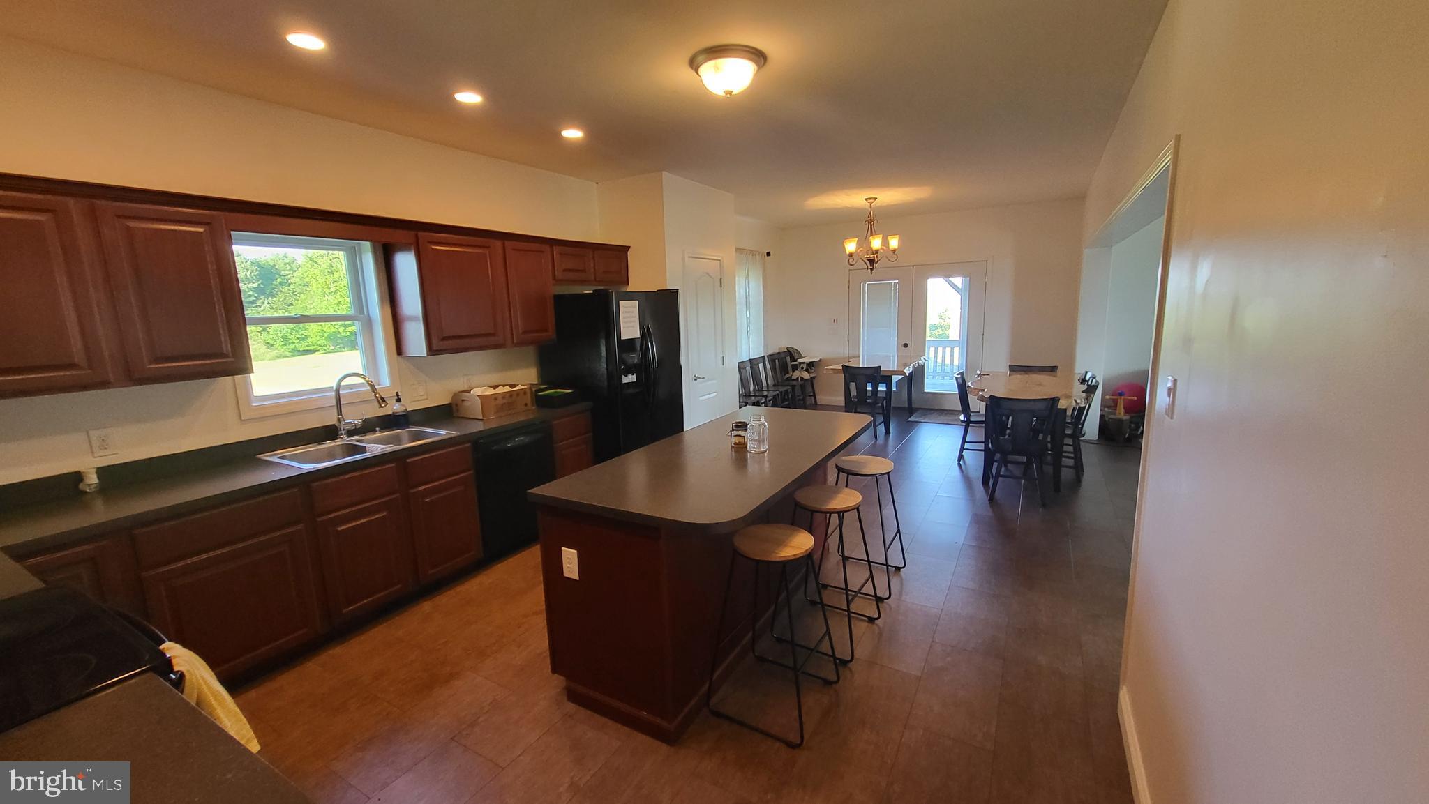 200 Pisgah Rest Shermans Dale, PA 17090 - Photo 8 of 23 a kitchen with a table chairs sink and cabinets