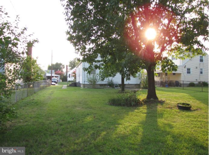 2611 Lynbrook Road Baltimore, MD 21222 - Photo 2 of 3 a view of a garden with trees