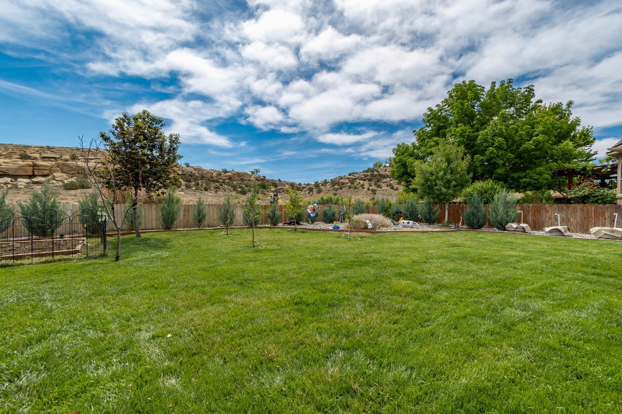 398 Butte Court Grand Junction, CO 81507 - Photo 27 of 33 a view of a park with large trees