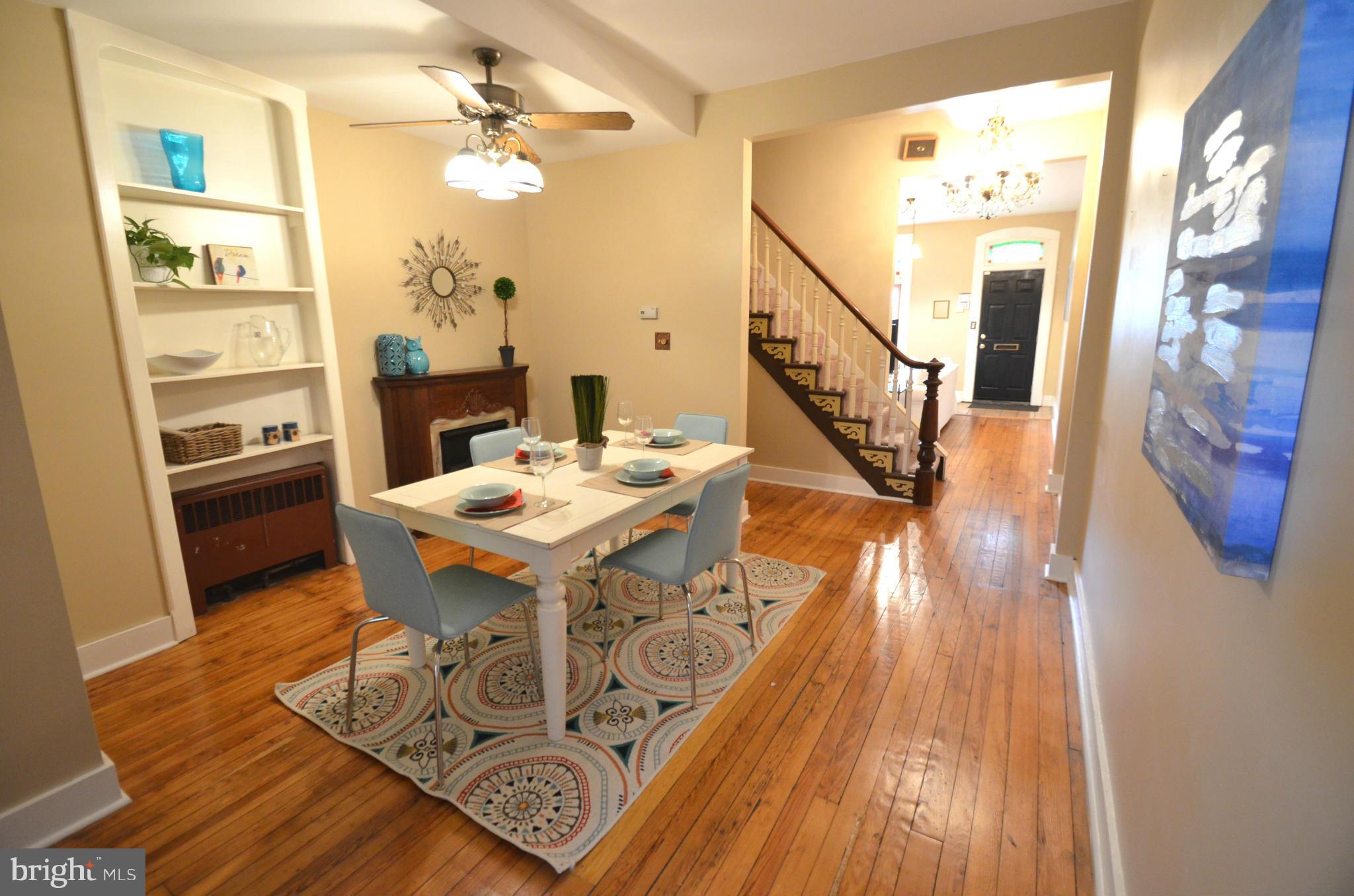 2309 Eastern Avenue Baltimore, MD 21224 - Photo 1 of 30 a view of a dining room with furniture a chandelier and wooden floor