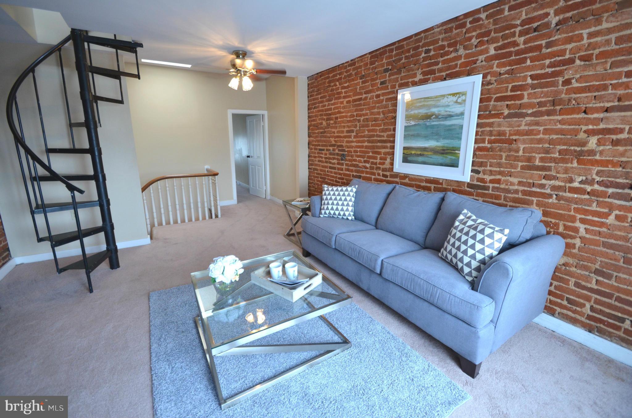 2309 Eastern Avenue Baltimore, MD 21224 - Photo 13 of 30 a living room with furniture and wooden floor