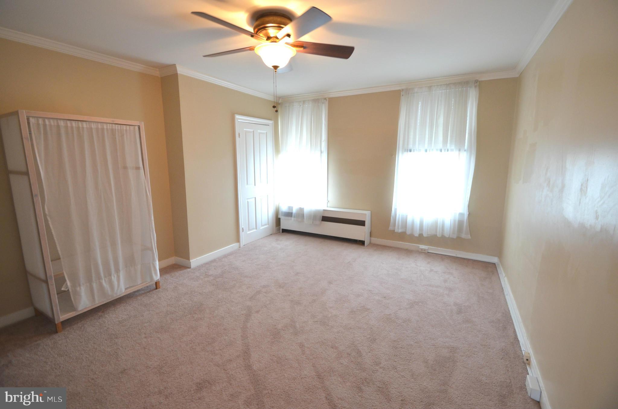 2309 Eastern Avenue Baltimore, MD 21224 - Photo 14 of 30 an empty room with windows and fan