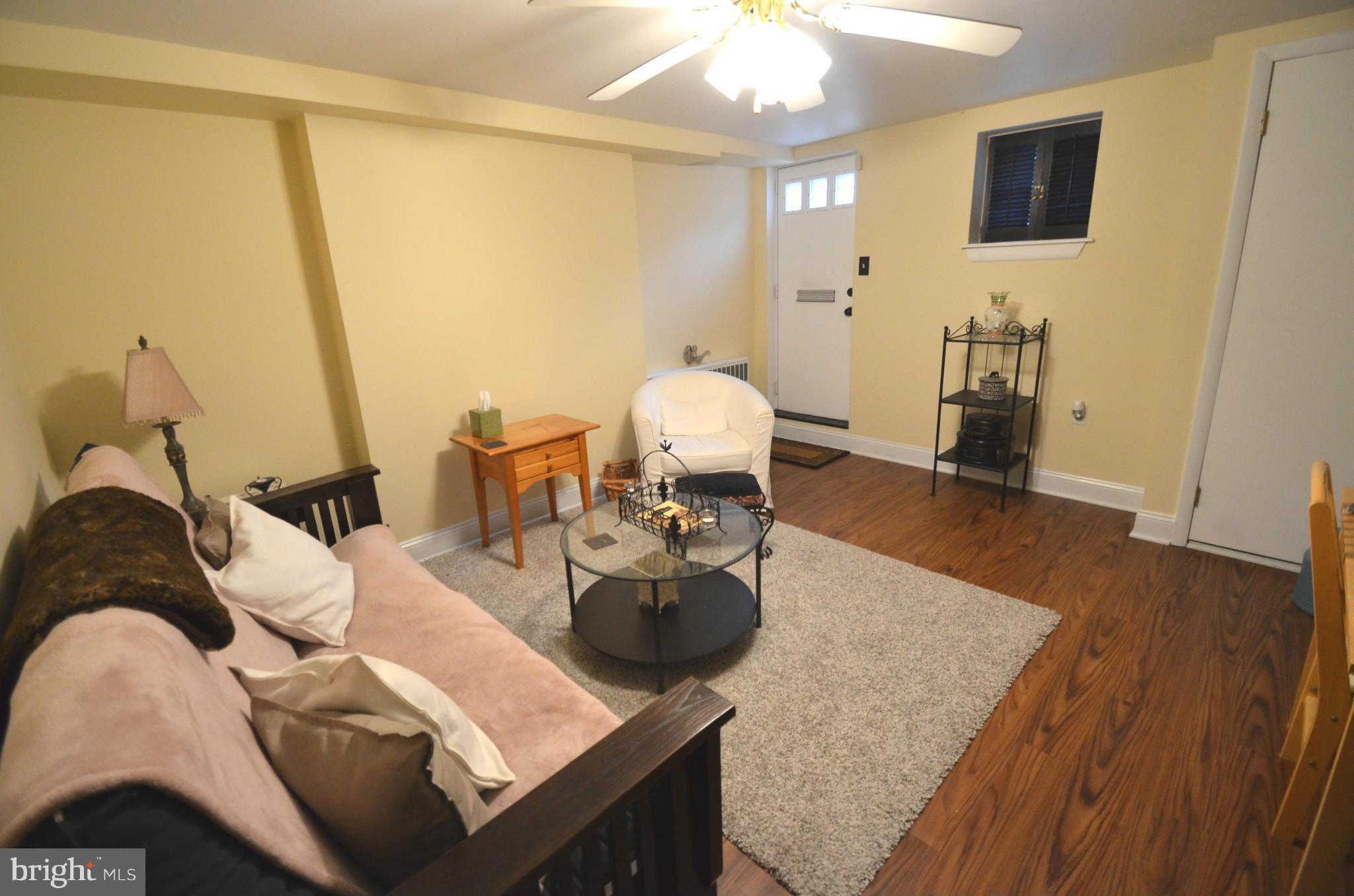 2309 Eastern Avenue Baltimore, MD 21224 - Photo 17 of 30 a living room with furniture and a wooden floor