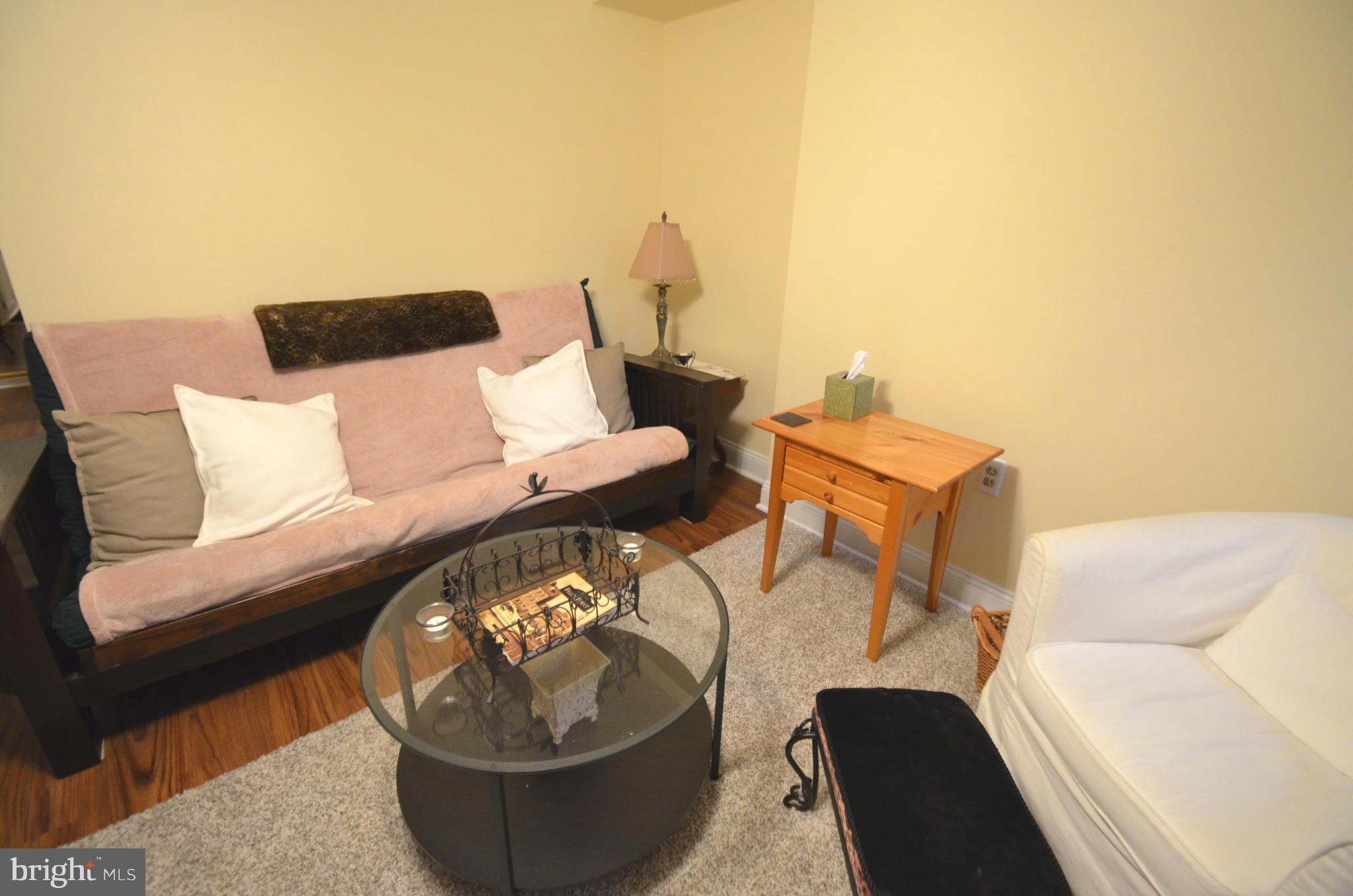 2309 Eastern Avenue Baltimore, MD 21224 - Photo 18 of 30 a living room with furniture and a lamp