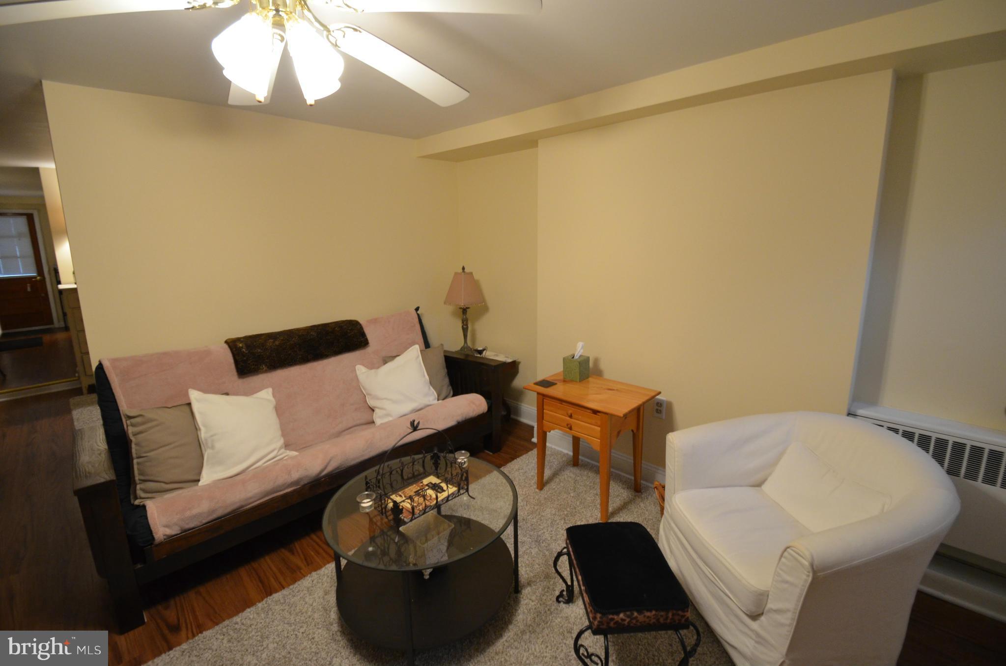2309 Eastern Avenue Baltimore, MD 21224 - Photo 19 of 30 a living room with furniture and a lamp