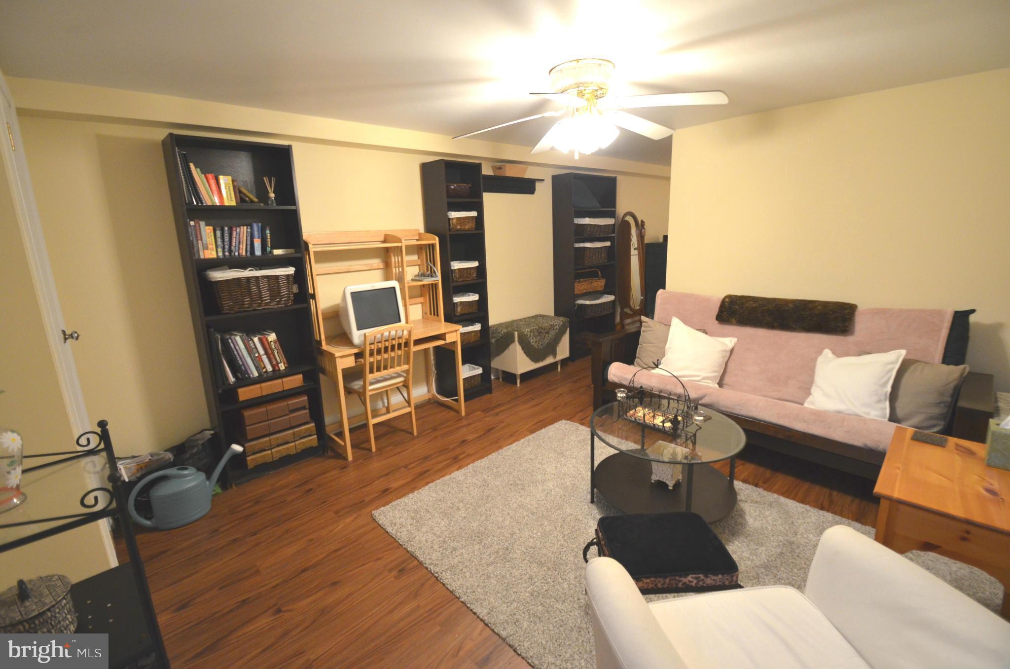 2309 Eastern Avenue Baltimore, MD 21224 - Photo 21 of 30 a living room with furniture and a flat screen tv