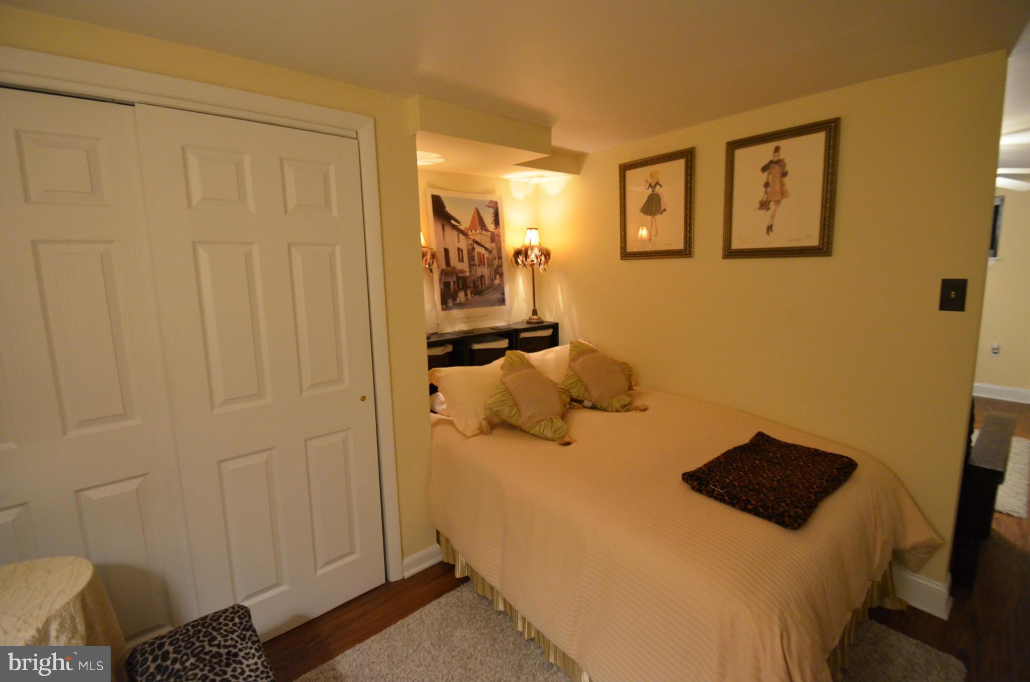 2309 Eastern Avenue Baltimore, MD 21224 - Photo 23 of 30 a bedroom with a bed and hallway