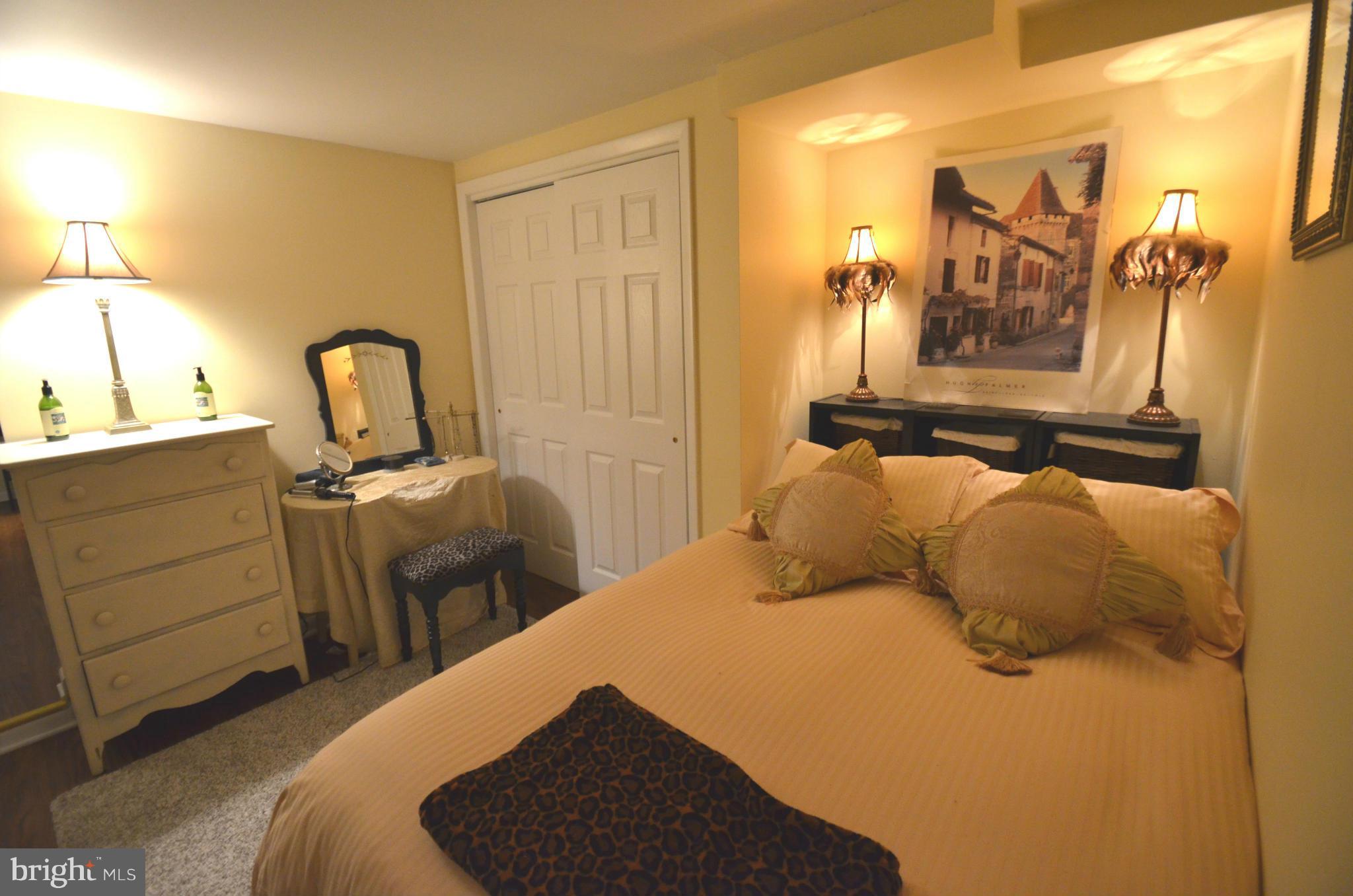 2309 Eastern Avenue Baltimore, MD 21224 - Photo 24 of 30 a bedroom with a bed and furniture