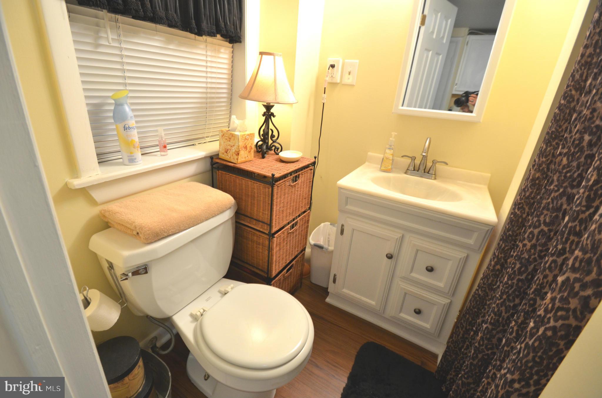 2309 Eastern Avenue Baltimore, MD 21224 - Photo 26 of 30 a white toilet sitting next to a bathroom sink