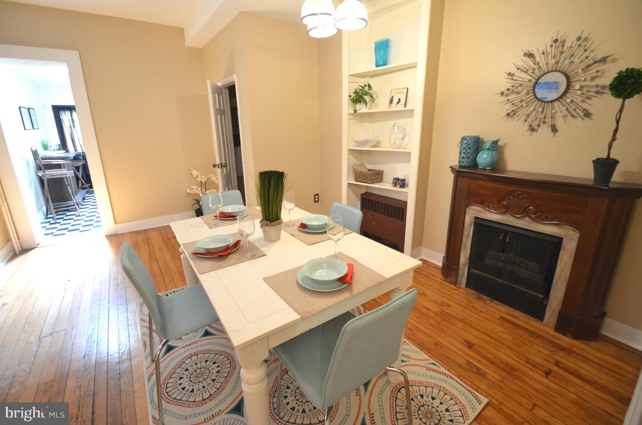 2309 Eastern Avenue Baltimore, MD 21224 - Photo 4 of 30 a dining room with furniture and wooden floor
