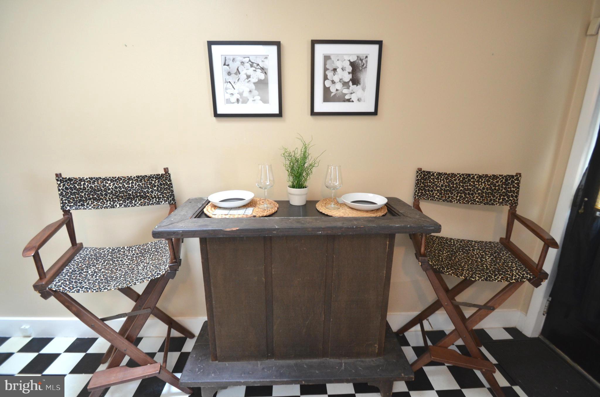 2309 Eastern Avenue Baltimore, MD 21224 - Photo 6 of 30 a view of a dining room with furniture and wooden floor