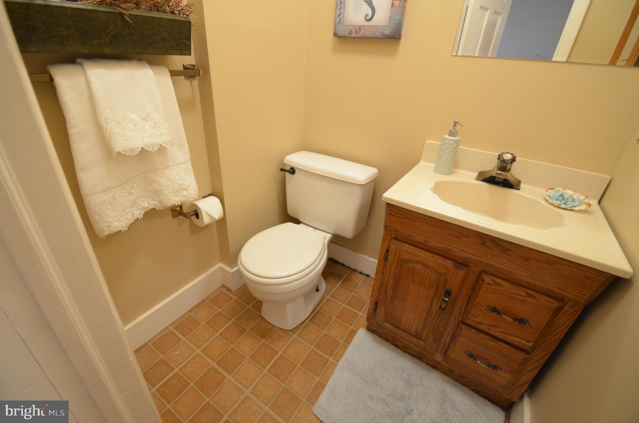 2309 Eastern Avenue Baltimore, MD 21224 - Photo 7 of 30 a bathroom with a sink and a toilet