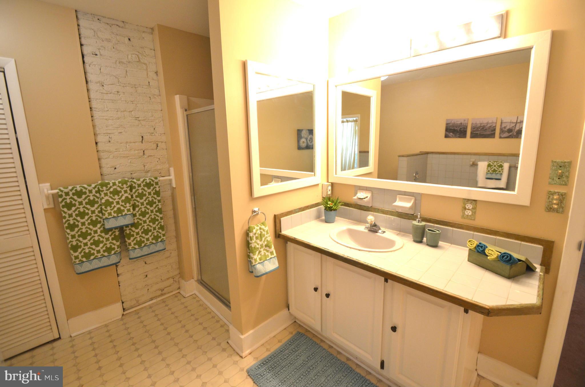 2309 Eastern Avenue Baltimore, MD 21224 - Photo 9 of 30 a bathroom with a sink and a mirror