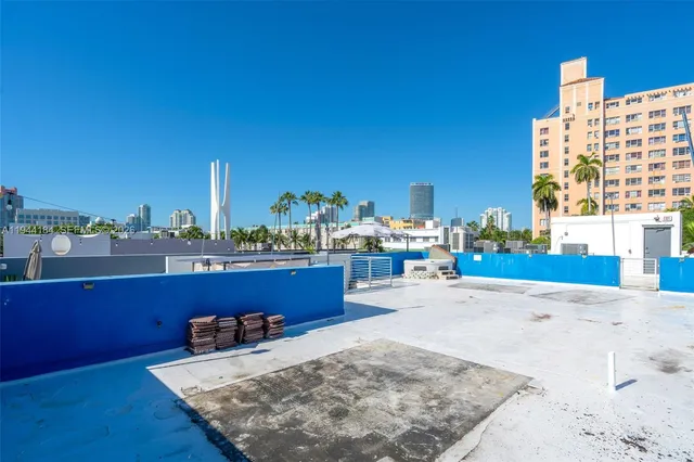 a view of a living room and a kitchen