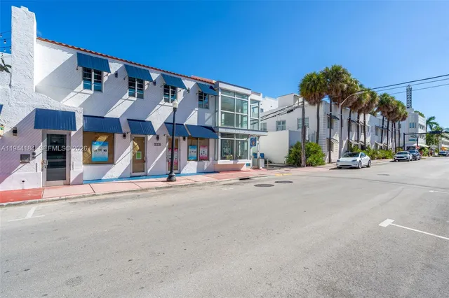 a view of a street with cars