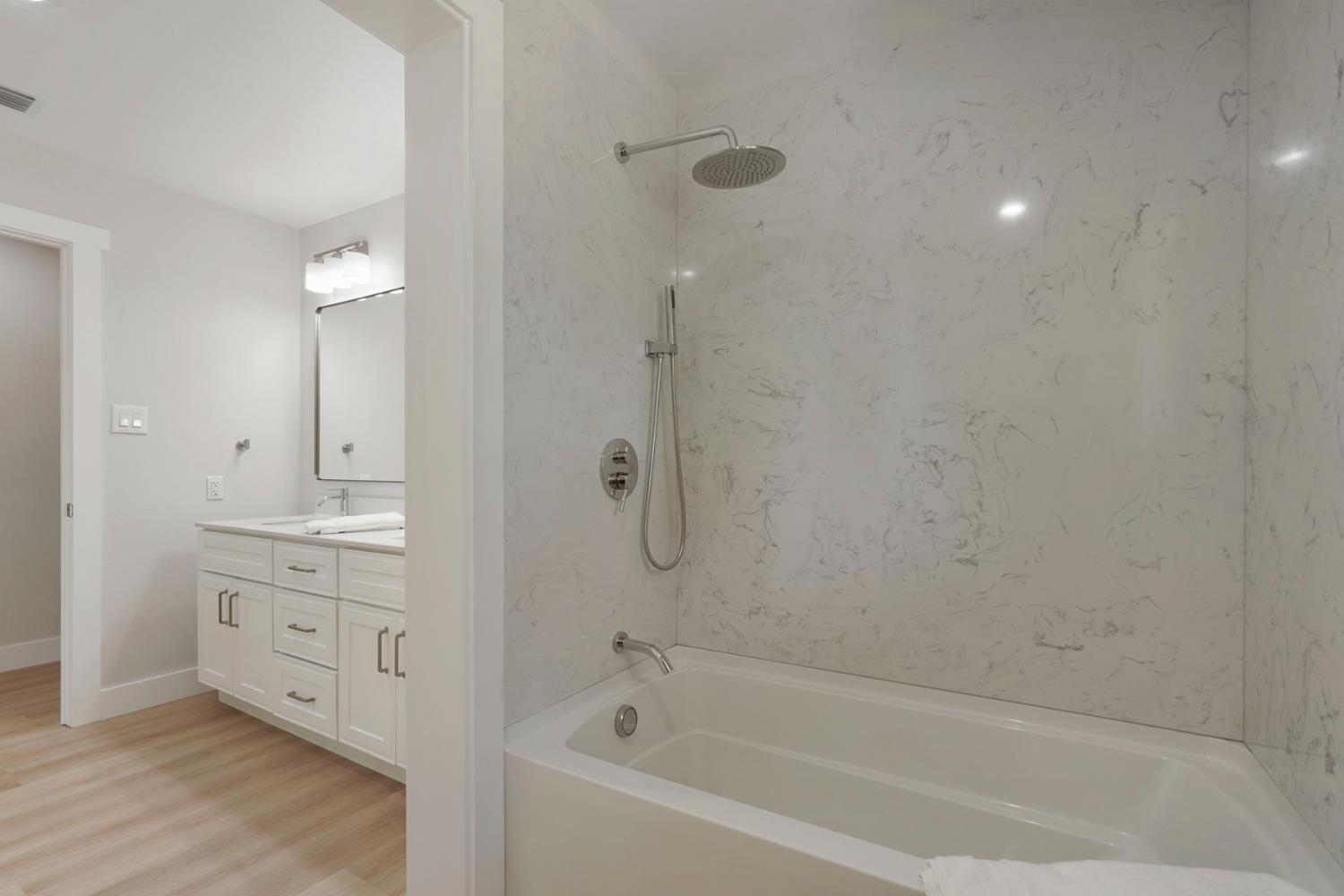 2650 West Twitchell Island Road Rio Vista, CA 94571 - Photo 14 of 60 a bathroom with a bathtub and a sink