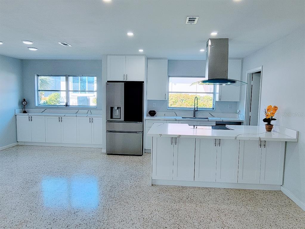 1732 Boca Raton Court Punta Gorda, FL 33950 - Photo 23 of 64 a kitchen with stainless steel appliances a microwave a sink and a refrigerator