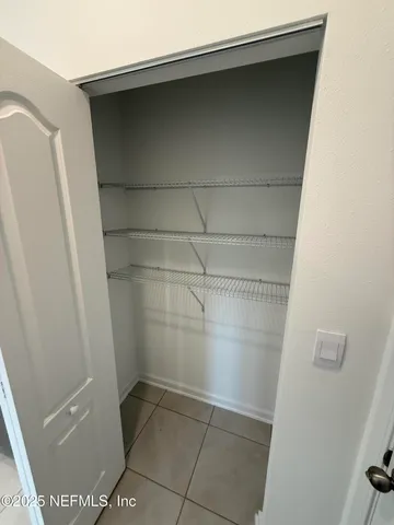 a bathroom with a glass door shower