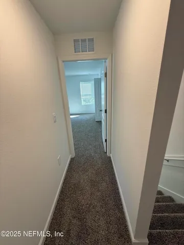 a view of hallway with stairs