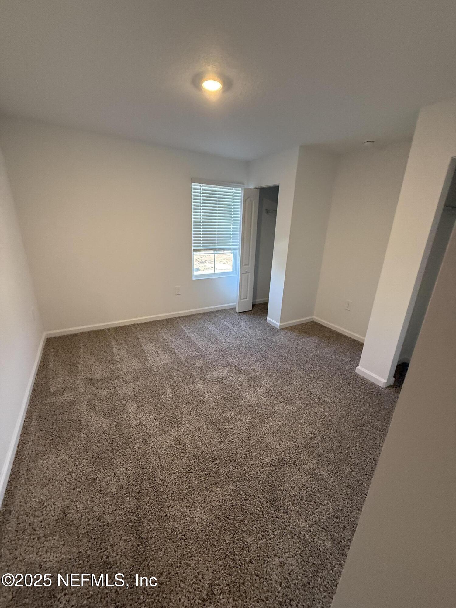 55 Blue Hvn Road St. Augustine, FL 32095 - Photo 27 of 29 an empty room with windows