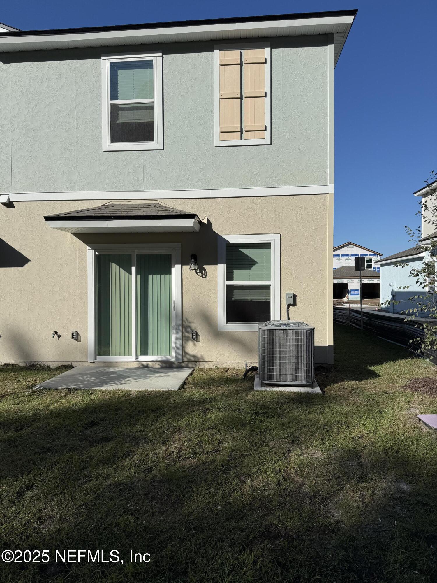 55 Blue Hvn Road St. Augustine, FL 32095 - Photo 7 of 29 a living room with furniture and a fireplace