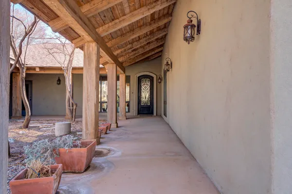 a view of a hallway with seating area