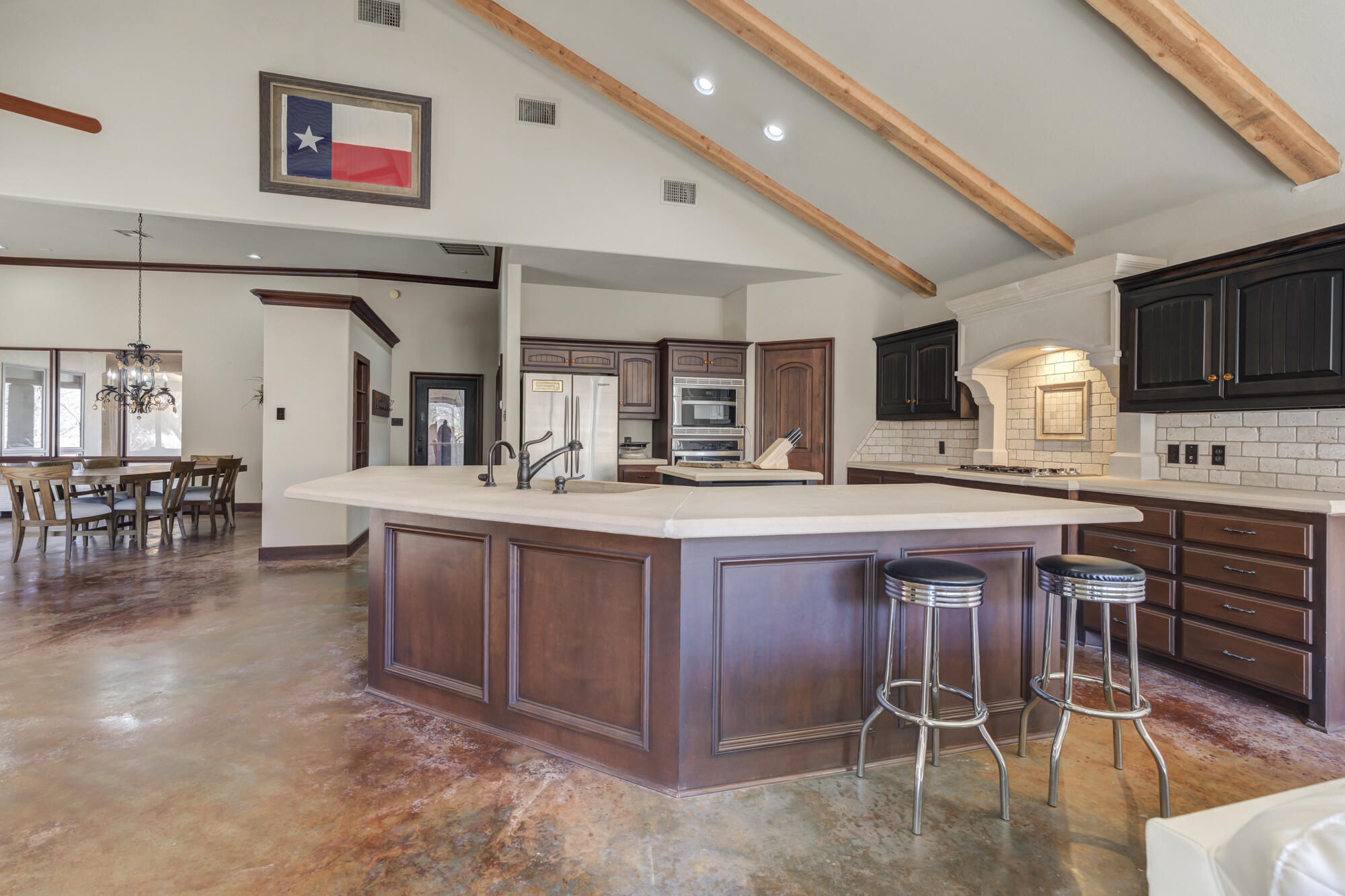 41 South Lake Shore Drive Ransom Canyon, TX 79366 - Photo 24 of 56 a large white dining table chairs and a large window