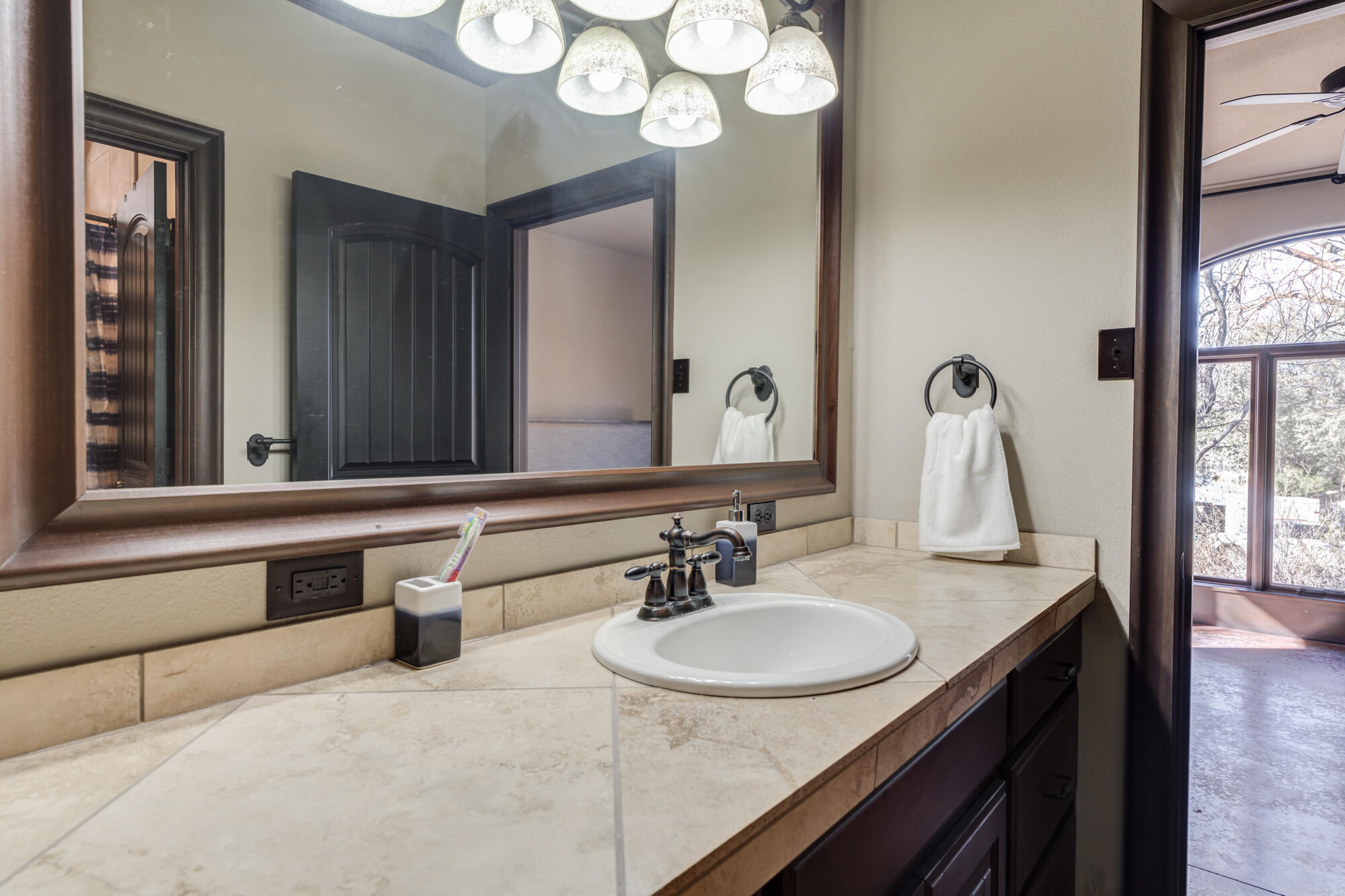41 South Lake Shore Drive Ransom Canyon, TX 79366 - Photo 31 of 56 a bathroom with a sink and a mirror