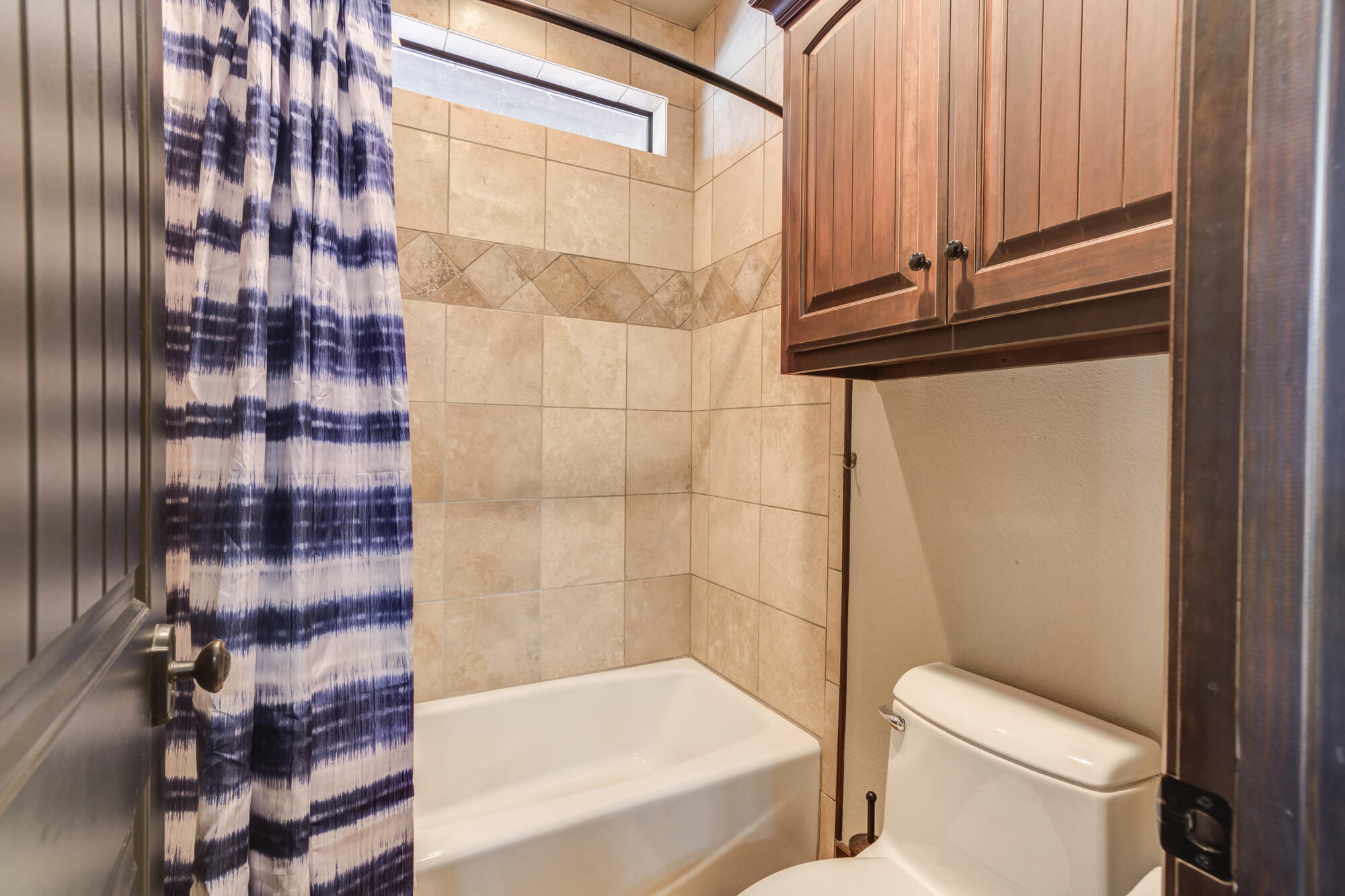 41 South Lake Shore Drive Ransom Canyon, TX 79366 - Photo 32 of 56 a bathroom with a shower and a toilet