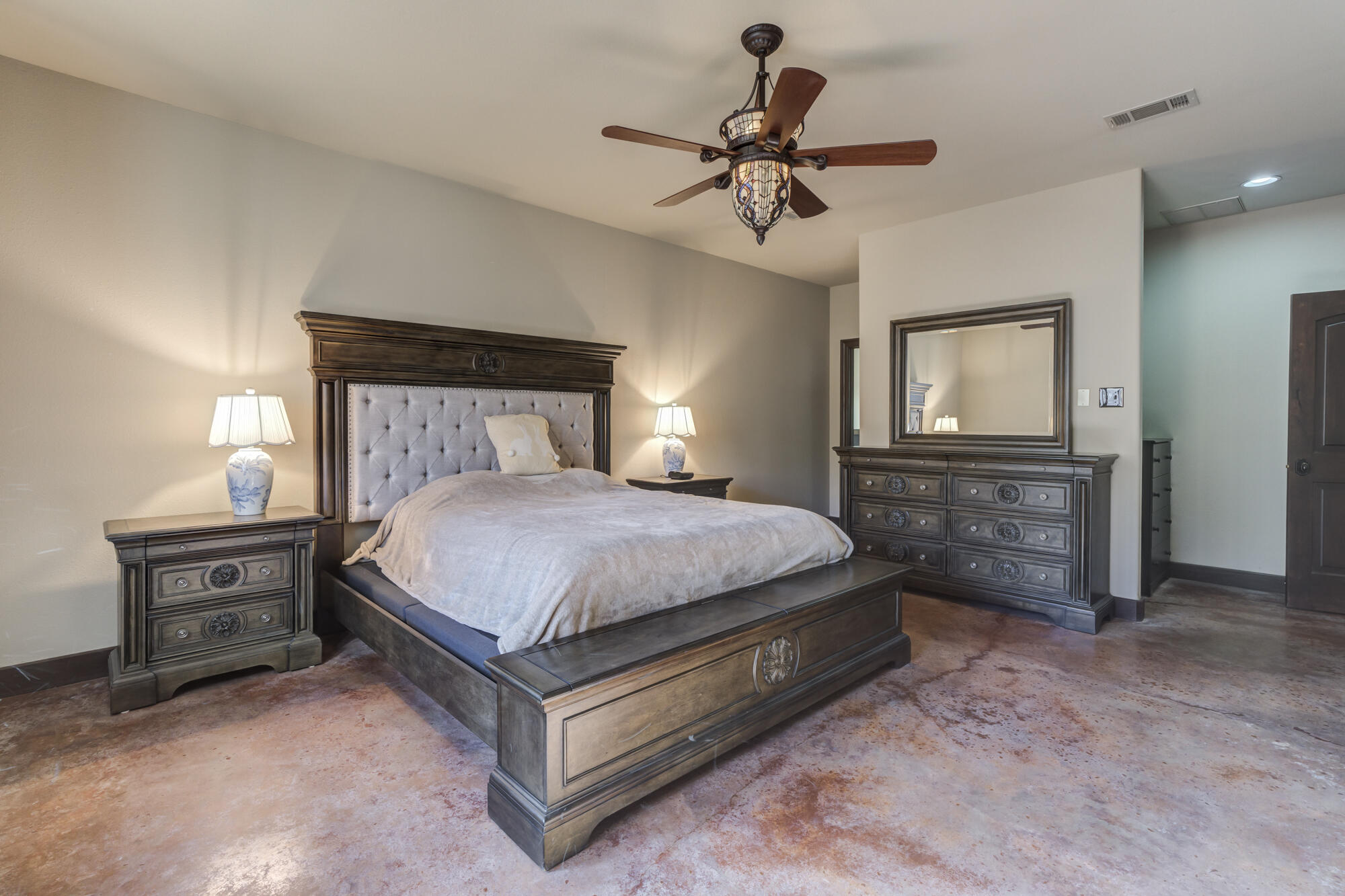 41 South Lake Shore Drive Ransom Canyon, TX 79366 - Photo 36 of 56 a bed sitting in a bedroom chandelier and dresser