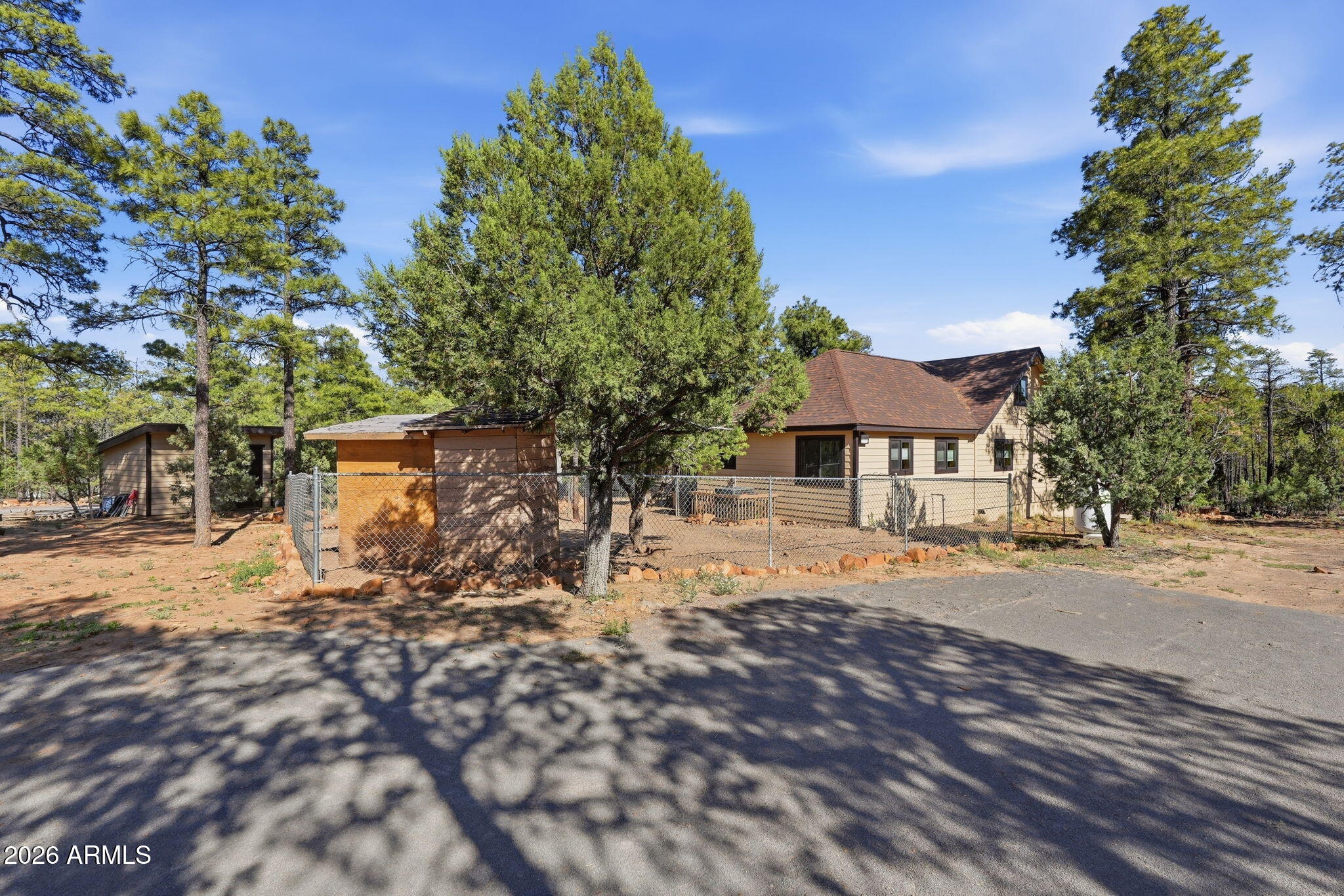 2060 Gilbert Lane Overgaard, AZ 85933 - Photo 68 of 87 a front view of a house with a yard