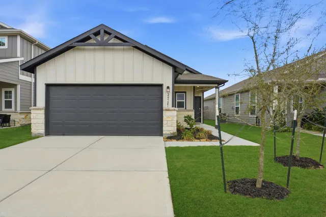 a view of house with backyard