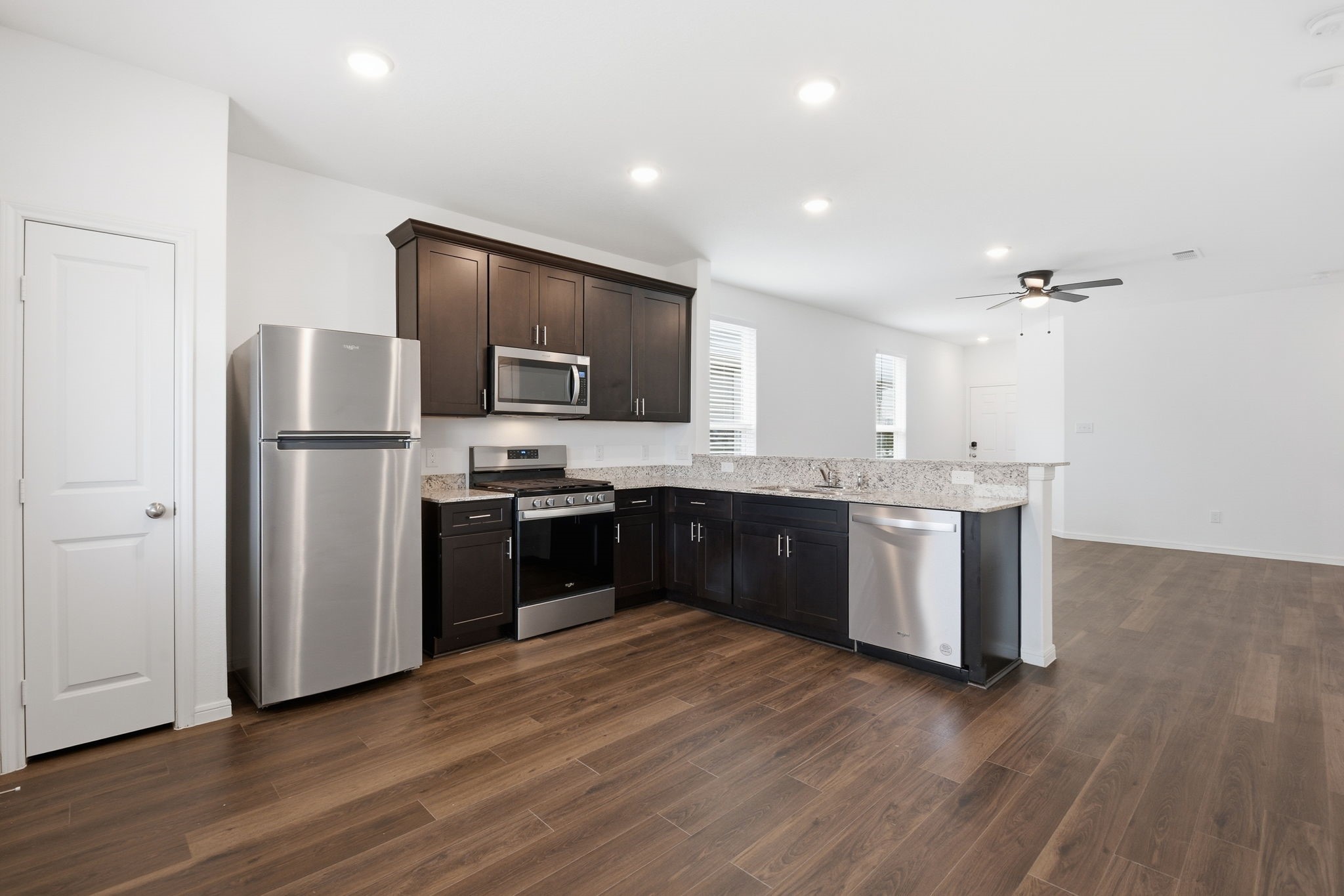 24721 Cherry Log Lane Porter, TX 77365 - Photo 14 of 36 a kitchen with a refrigerator and a sink