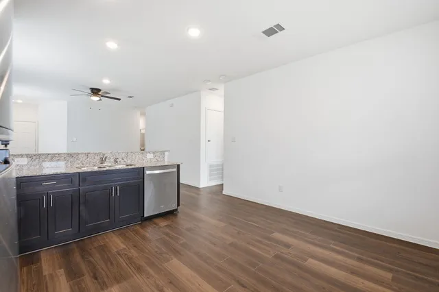a large bathroom with a sink and a large mirror