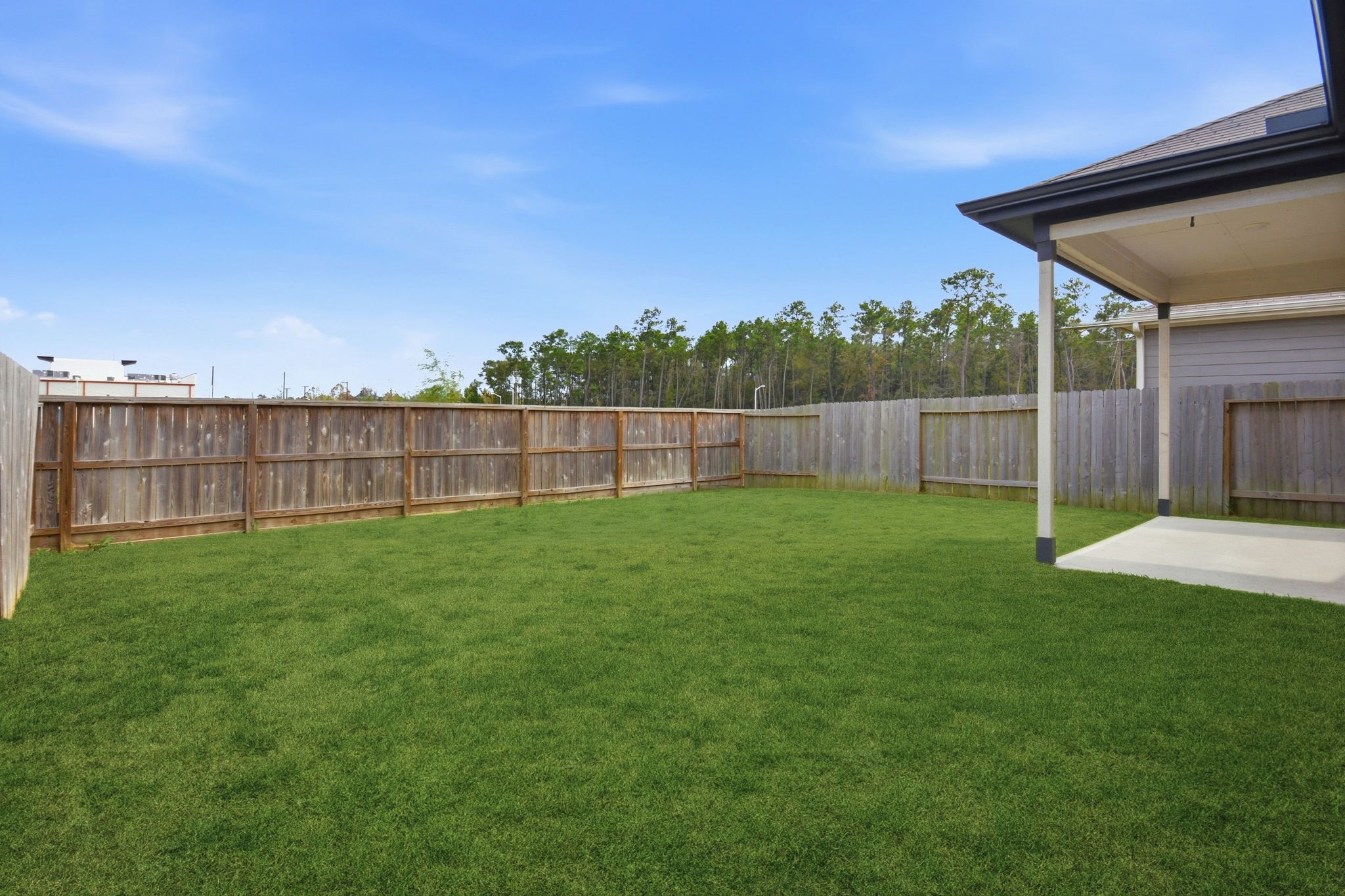 24721 Cherry Log Lane Porter, TX 77365 - Photo 35 of 36 a view of a backyard with a wooden fence