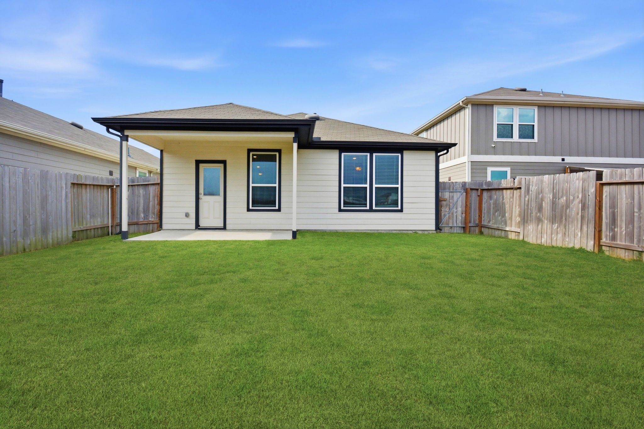 24721 Cherry Log Lane Porter, TX 77365 - Photo 36 of 36 a front view of a house with a garden and yard