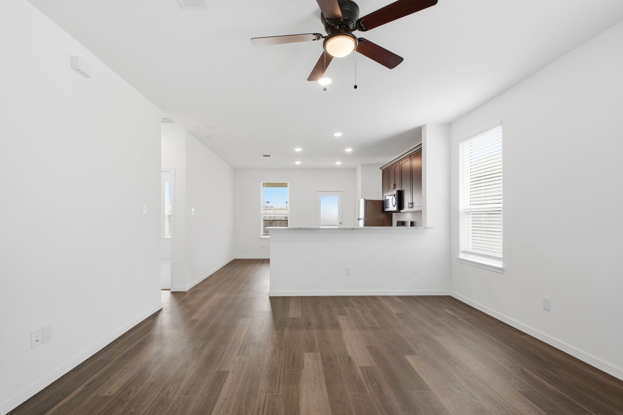 24721 Cherry Log Lane Porter, TX 77365 - Photo 10 of 36 wooden floor in an empty room with a window