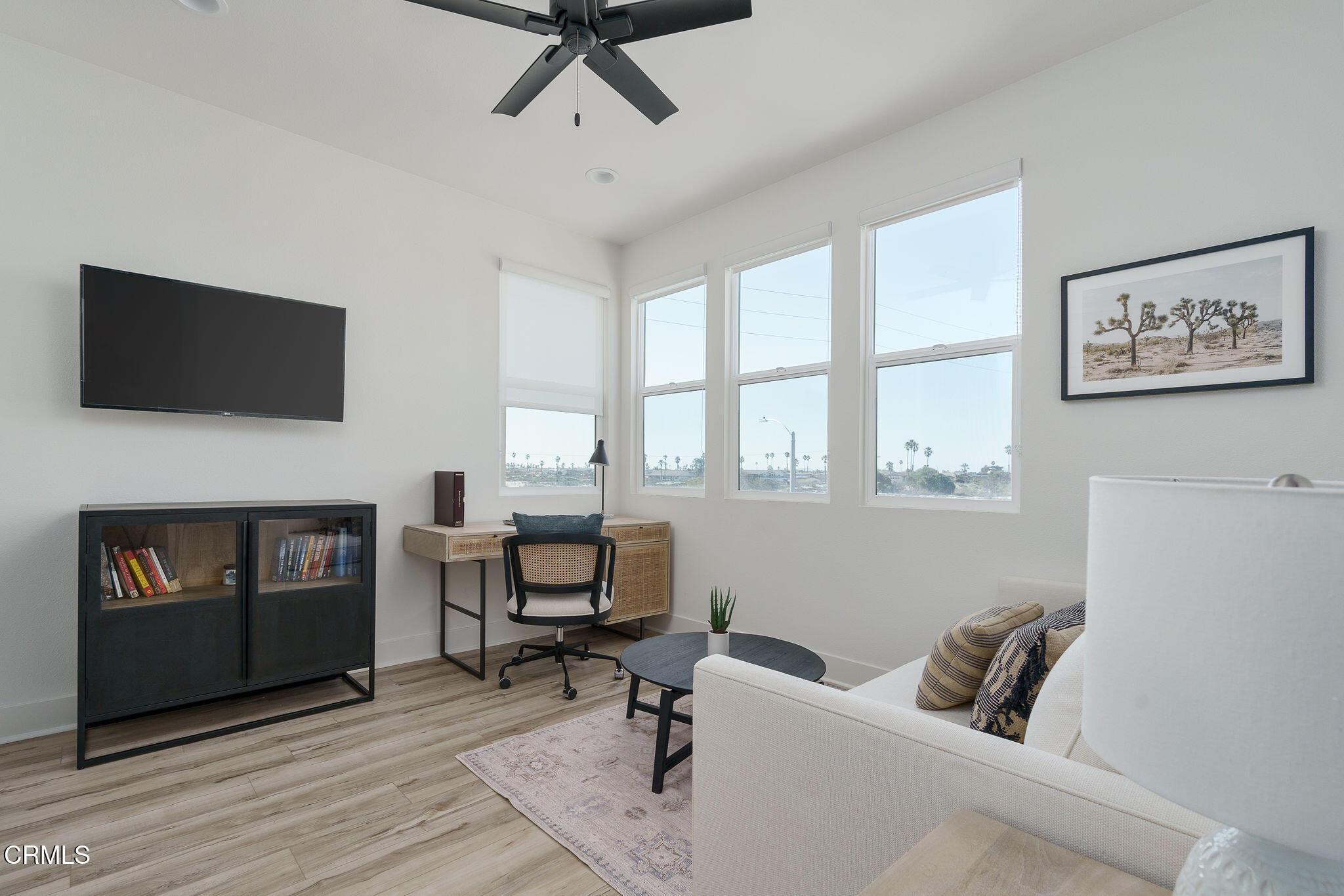 1066 Canal Street Oxnard, CA 93035 - Photo 18 of 34 a view of a livingroom with workspace and a window