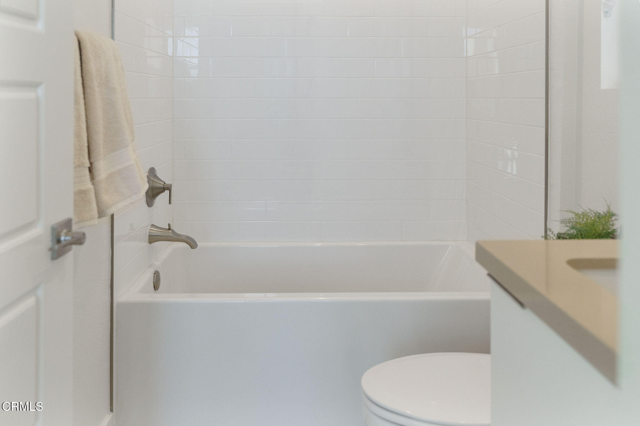 1066 Canal Street Oxnard, CA 93035 - Photo 20 of 34 a bathroom with a shower a toilet and a sink