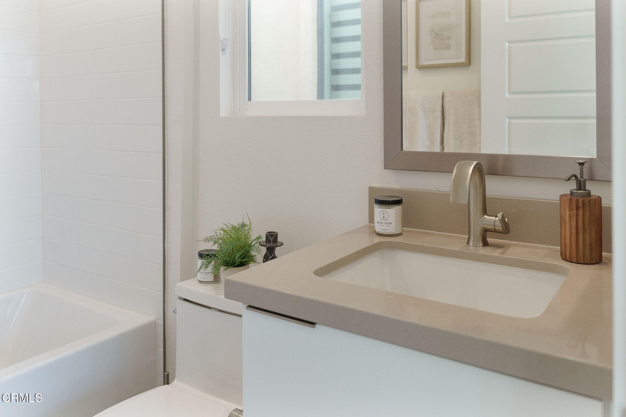 1066 Canal Street Oxnard, CA 93035 - Photo 21 of 34 a bathroom with a sink and a bathtub