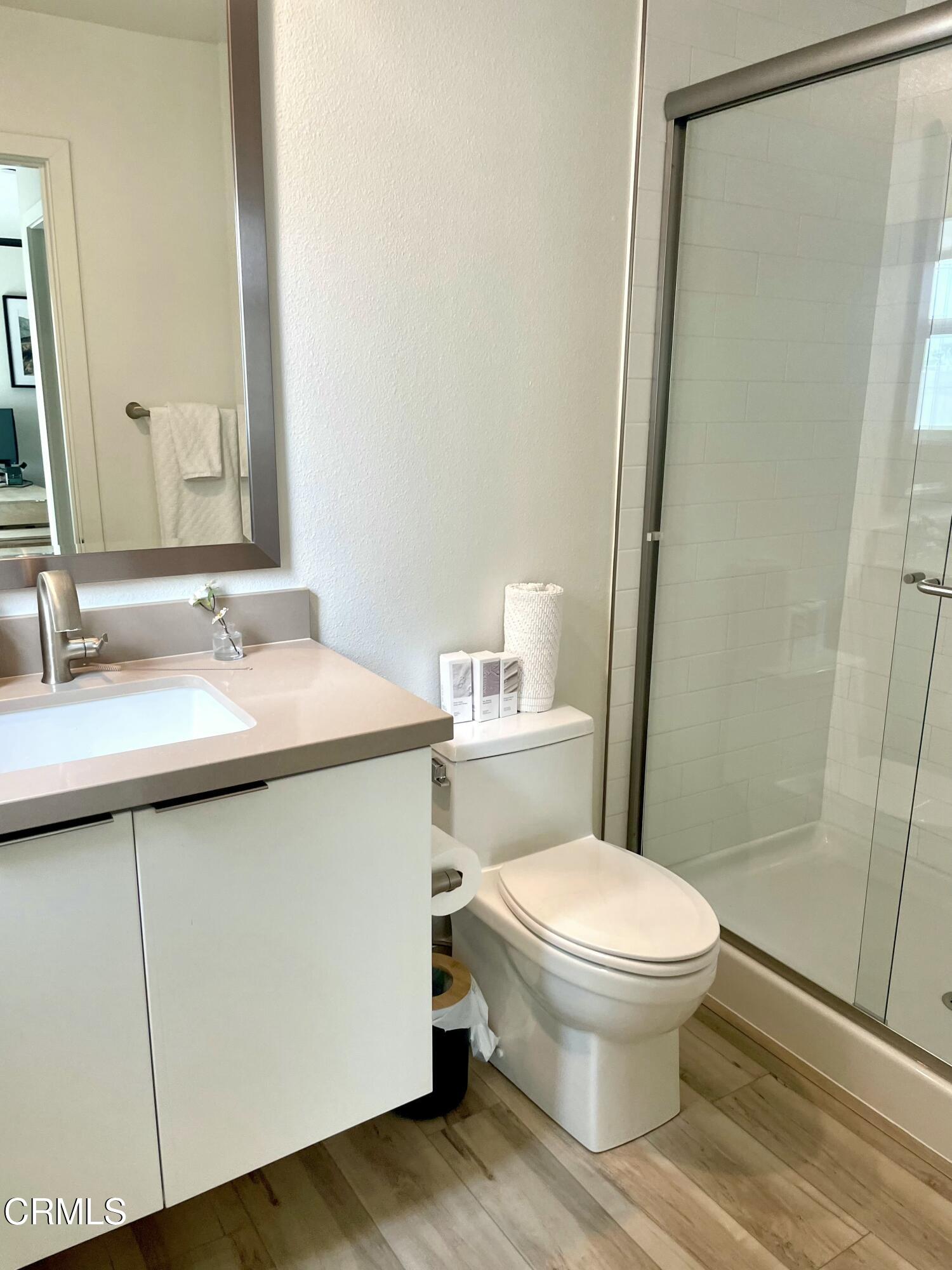 1066 Canal Street Oxnard, CA 93035 - Photo 28 of 34 a bathroom with a sink toilet and shower