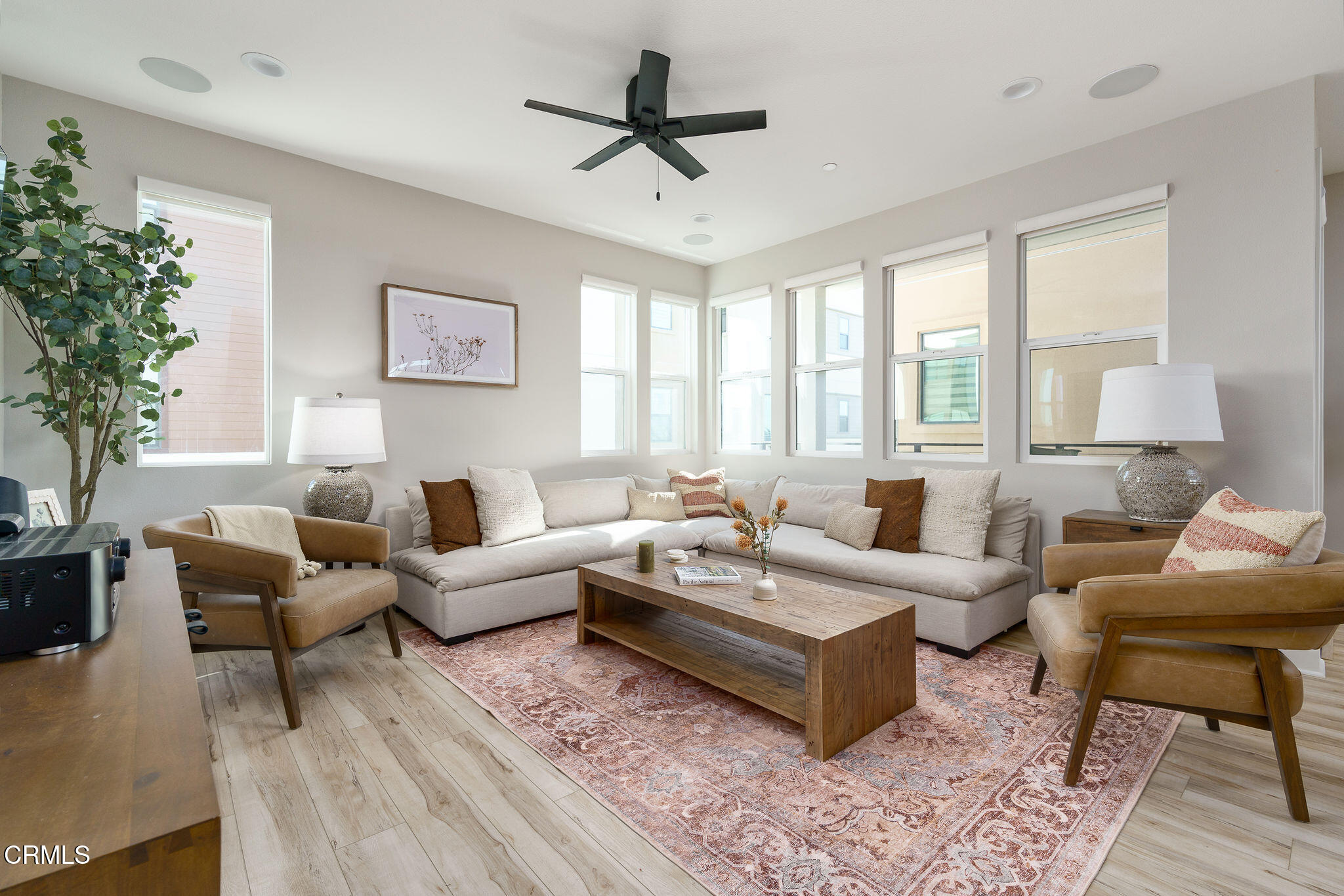 1066 Canal Street Oxnard, CA 93035 - Photo 3 of 34 a living room with furniture a chandelier and a large window