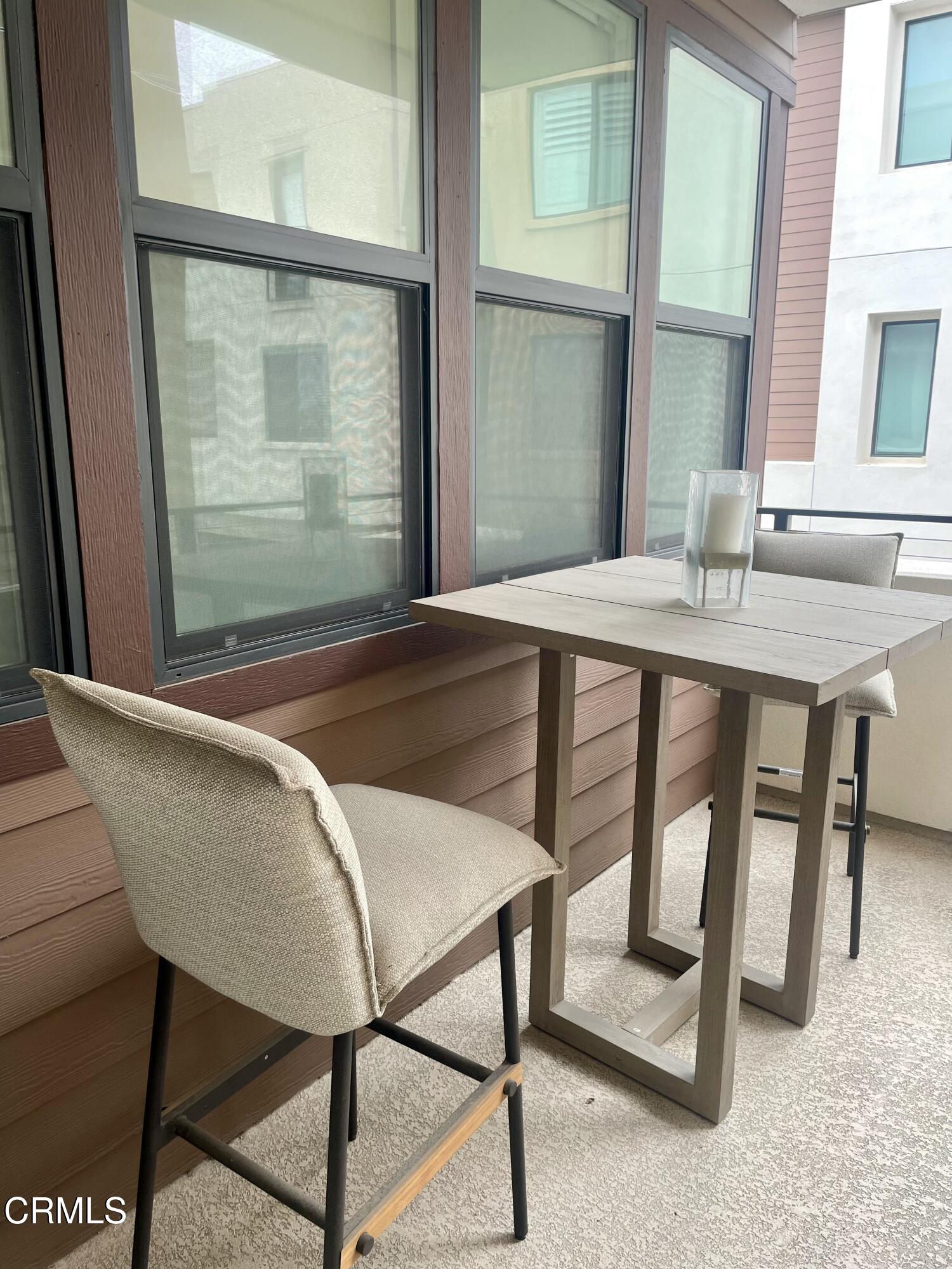 1066 Canal Street Oxnard, CA 93035 - Photo 33 of 34 a dining room with a table and chairs