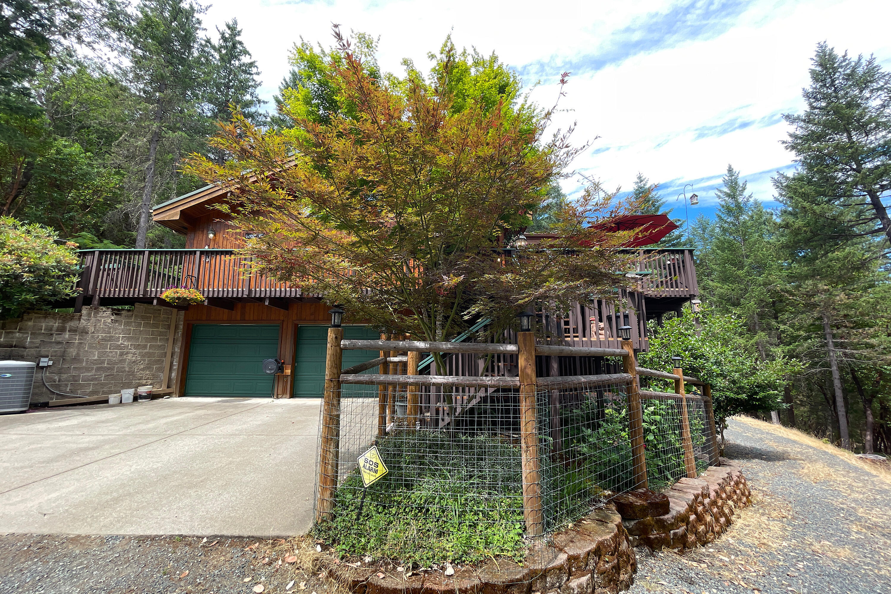 856 Greentree Loop Grants Pass, OR 97527 - Photo 48 of 62 a house view with a garden space
