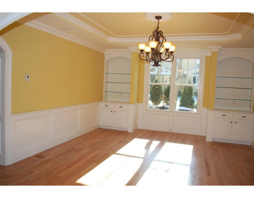 3 Martingale Road, Unit LOT #1 Lexington, MA 02421 - Photo 3 of 10 a living room with a large window chandelier and flower cabinets