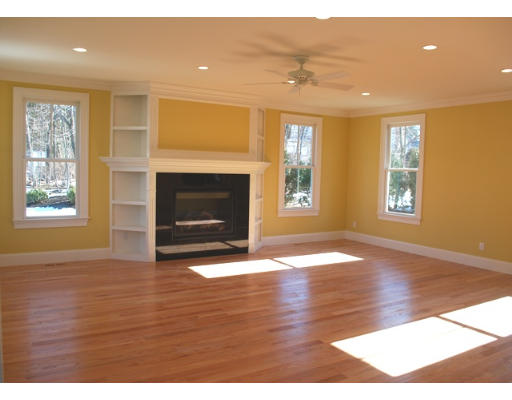 3 Martingale Road, Unit LOT #1 Lexington, MA 02421 - Photo 4 of 10 a view of an empty room with window and fire place